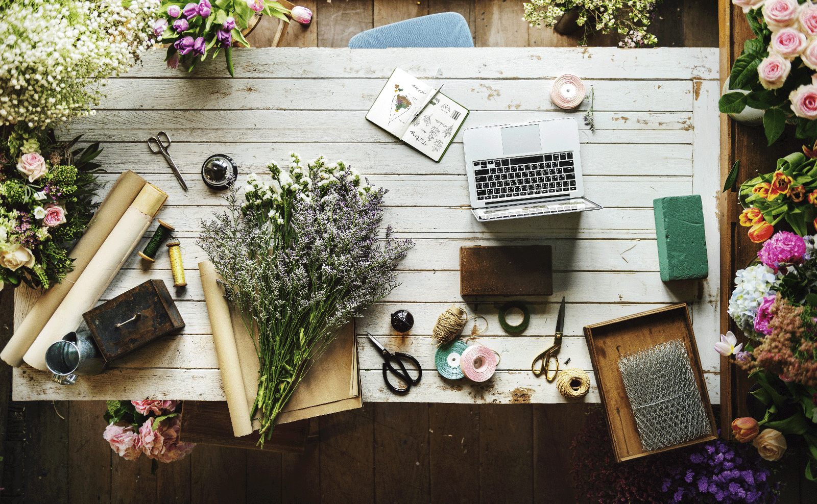 Artisan florist handcrafting floral arrangement